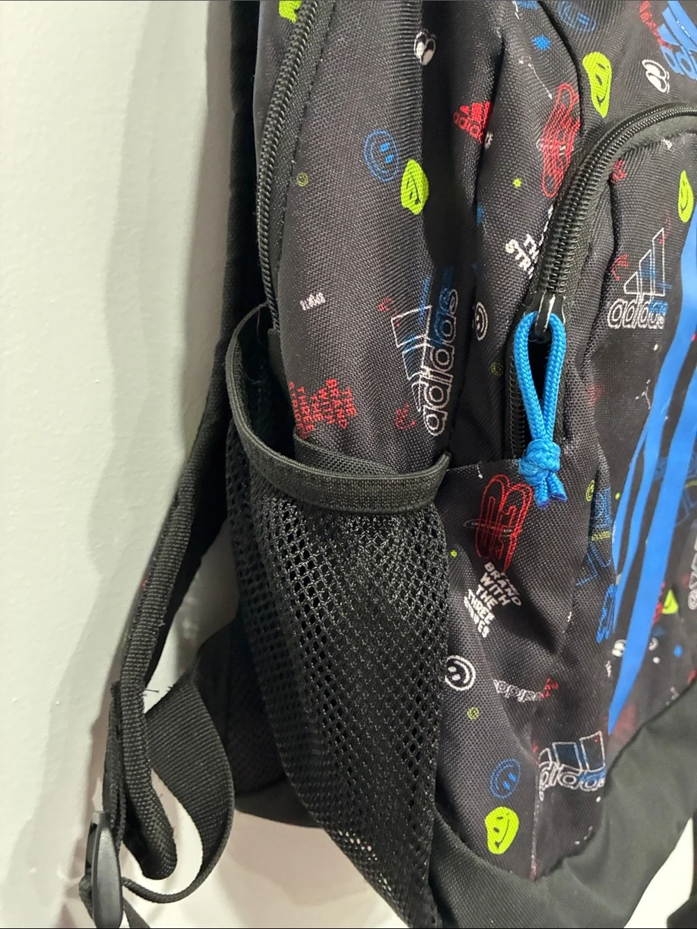 adidas Black Backpack with Bright Blue Stripes and Multicolor Accents